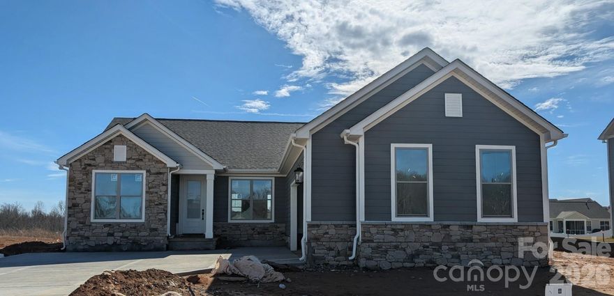 As you walk through the entry you will find yourself in an open floorplan with a fully loaded kitchen and culinary paradise that's ready to turn you into a gourmet chef. The white cabinets and sleek quartz countertops are like a blank canvas waiting for your culinary masterpieces. The kitchen island is a great place to meal prep, making it a hub for both cooking and conversations. Off the kitchen is the spacious family room, a cozy haven for movie nights and gatherings with friends. It's the perfect spot to unleash your inner decorator with endless possibilities for personalization. Out back you will find a covered porch with ceiling fan for relaxation. 

Please ask about our builder incentives!