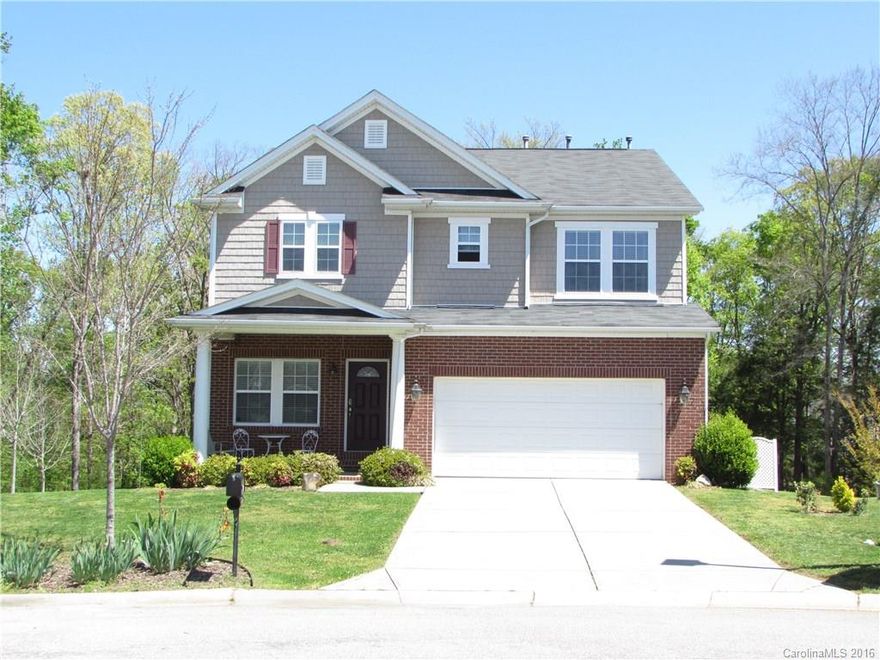 Open floor plan with hardwoods throughout main. Large kitchen w/ oversized island, stainless appliances, granite counter tops, cherry cabinets, crown molding and recessed lighting. Huge master bedroom, WIC, master bath w/separate shower/tub, and dual sinks. Bedroom & full bath on main & huge Loft/Rec room upstairs.  .93 ACRE lot on a Cul de sac wooded lot with tons of privacy. Deck & patio, unfinished basement w/structure for bedroom & full bath by the builder. Close to all & Fort Mill Schools.