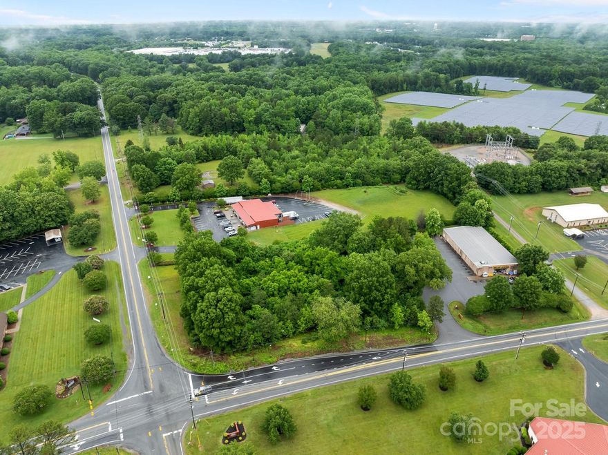 You don’t want to miss this opportunity to secure +/- 2.34 acres in a prime location! Ideally situated on the corner of Sherrills Ford Rd and Mooresville Rd. Currently Zoned NMX (Neighborhood Mixed Use) offering a variety of development options. Allows for a range of uses including residential single-family and multi-family, restaurant, general retail, office, etc. Location and corner parcel allows for ease of access, multiple points of entry, visibility and close proximity to Hwy 29 and I-85. Access to water and at a lighted intersection. Recently partially cleared.