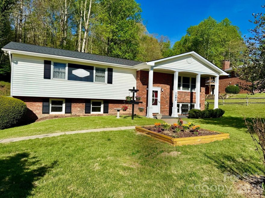 This well-kept home sits on a spacious double lot just 4.3 miles from downtown Brevard, giving you quick access to all the shopping, dining, and charm the area is known for. You’re also conveniently located near access to the French Broad River along with plenty of nearby hiking and biking trails.
Inside, the home offers 3 bedrooms and 2.5 bathrooms with an easy, open layout that connects the kitchen, dining, and living areas—great for everyday living or having folks over. The kitchen has already been updated with new flooring and fresh paint, giving it a clean, move-in-ready feel.
Downstairs adds even more usable space, whether you want a second living area, a home office, or a spot to relax by the fireplace. This level features all new tile and carpet, making it comfortable and updated. The oversized 2-car garage serves as a great workshop, and the yard offers plenty of room for all of your outdoor activities. One of the standout features here is the additional lot, which could potentially be used for another dwelling, guest house, RV parking, or detached garage—something that’s getting harder to find. All of this in a quiet setting, just minutes from town.