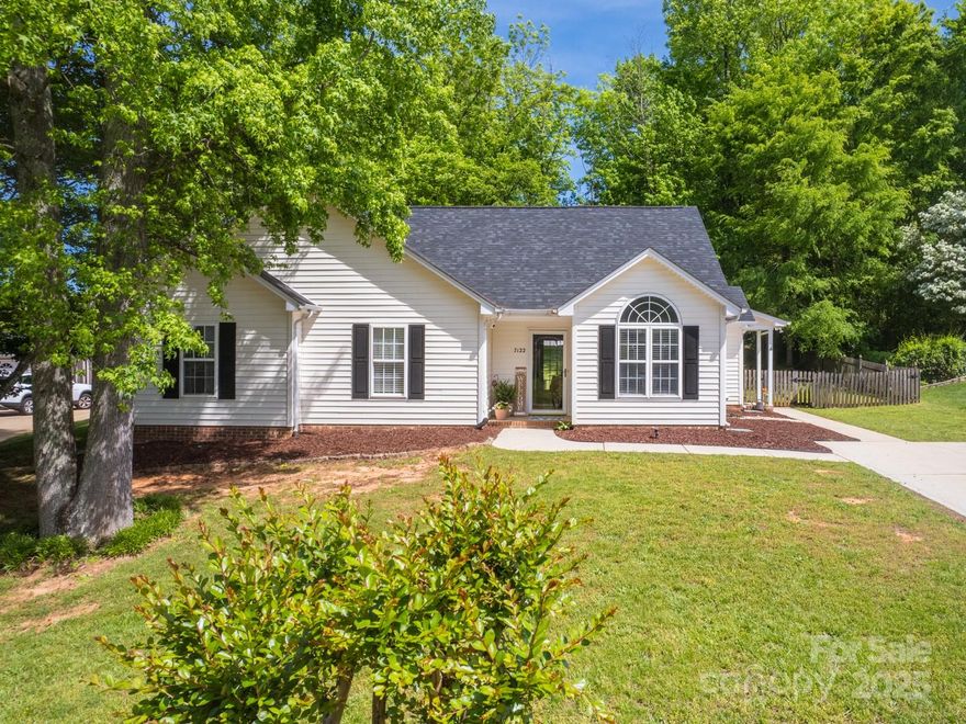 Welcome home to this charming updated ranch in a great location! Great starter home or perfect for down-sizing! The bright and airy kitchen features quartz countertops, open shelving, cheerful painted cabinets, space for dining and a pantry. Just steps away are the laundry room and the convenient side entry porch. The dining room with arched window and vaulted ceiling is great for entertaining or as office space. Large living room features a gas fireplace and room for a cozy sectional. Just down the hall, find the private owner's retreat with dual closets and an ensuite bath with a dual sink vanity. Two additional bedrooms plus another full bath make this one-level home easy to love. Enjoy time outside on the patio and in the spacious fenced backyard that's just waiting for your personal touch. New gas furnace 2024, new water heater 2023. Per previous sellers roof replaced 2018. Large fenced yard. No HOA! Storage building and playset to convey.