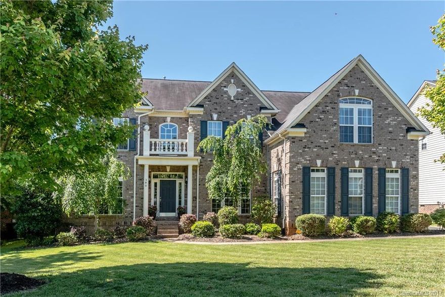 Gorgeous brick front home in swim community. Hardwood floor leads from foyer through the dining room, to the kitchen & breakfast area. Gourmet kitchen features recessed lighting, granite counters, stainless steel appliances, & custom backsplash. Guest room on main floor w/ full bath access.  Dual wood tread staircases w/ wrought iron pickets. Master suite w/ sitting room, tray ceiling, dual walk-in closets, & private bath w/ dual vanities, soaking tub, & oversized shower. Guest ste w/ en suite.