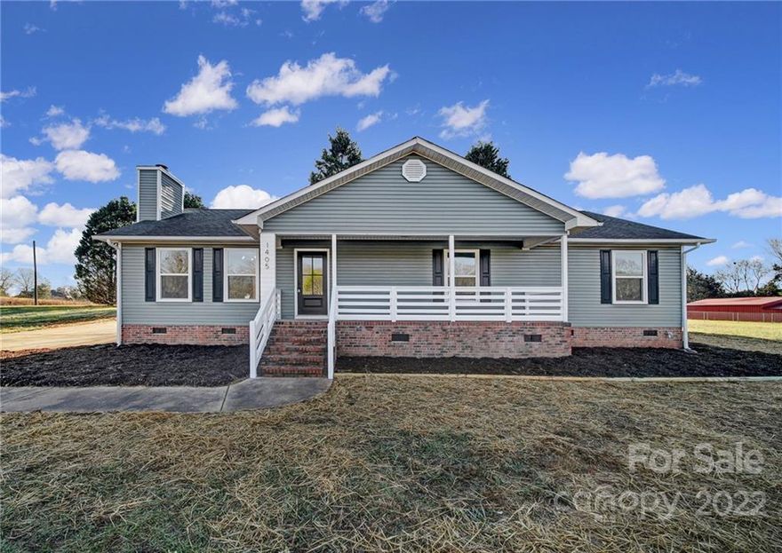 Welcome home to this beautifully remodeled modern farmhouse on over an acre! This ranch-style home has been completely updated and features items typically only found at a much higher pricepoint. Show-stopping kitchen with white shaker cabinets, stainless appliances, and matte black subway tile backsplash. Spacious primary bedroom with sliding barn door to walk in closet with custom closet shelving. Primary bathroom features jaw-dropping full tile shower and rain showerhead! Rocking chair covered front porch and large rear deck outside with wired workshop and separate storage building. Come see this gem today!