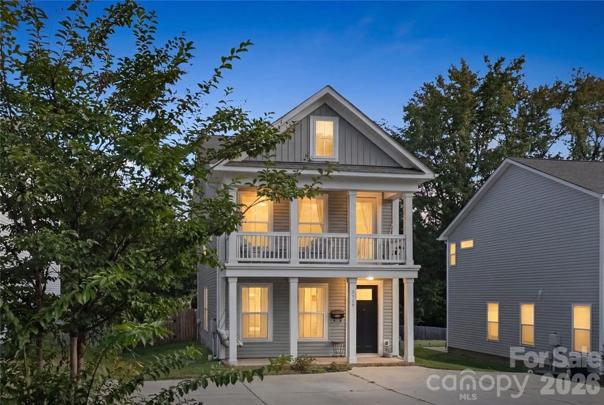 This 2020-built home in Plaza-Shamrock offers modern design, move-in-ready condition, and one of the most desirable combinations in Charlotte; newer construction with a spacious yard in a Charlotte walkable neighborhood near Uptown!

Located just 5 minutes from NoDa and Plaza Midwood, 15 minutes from Uptown Charlotte, and a 10 minute walk from Shamrock Park. This home is ideal for buyers seeking a modern home close to restaurants, breweries, coffee shops, parks, and everyday conveniences. Sidewalk-lined streets and nearby dining options make it possible to enjoy the Plaza-Shamrock lifestyle without always needing a car, a rare find in this price point.

Inside, the open-concept main level features 9-foot ceilings, 8-foot doors, and durable LVP flooring throughout the primary living areas and abundant natural light that enhances the bright and airy feel of the home. The kitchen is a chef's dream designed for both entertaining and everyday living, with quartz countertops, a large island and peninsula, gas range, herringbone tile backsplash, stainless steel appliances, and modern cabinetry and hardware.

Upstairs, the spacious primary suite offers a private balcony retreat, walk-in closet, and spa-inspired en-suite with dual-sink vanity and oversized shower. Two additional bedrooms and a full bath provide flexibility for guests, home office space, or roommate potential.

Outdoor living truly sets this property apart. The fully fenced backyard offers more space than many comparable homes in the area, with mature trees for added privacy, fruiting plants including blueberries, blackberries, and mulberries, a 10x12 storage shed, and room for pets to play, to entertain, garden, or create your own outdoor oasis. A covered front porch with swing adds even more charm and functionality.

Additional highlights include ample parking and the peace of mind of a remaining 10-year structural warranty through True Homes.

The home also qualifies for homebuyer programs through Huntington National Bank, offering up to $5,500 toward closing costs, no mortgage insurance, and a $5,000 bond that can be applied toward down payment or closing costs.

With its combination of location, yard space, newer construction, and incentives, this Plaza-Shamrock home presents a rare opportunity in one of Charlotte’s most vibrant and walkable neighborhoods. Enjoy morning coffee on the balcony, evenings in the fenced backyard, and quick access to NoDa, Plaza Midwood, and Uptown. Schedule your private showing today!