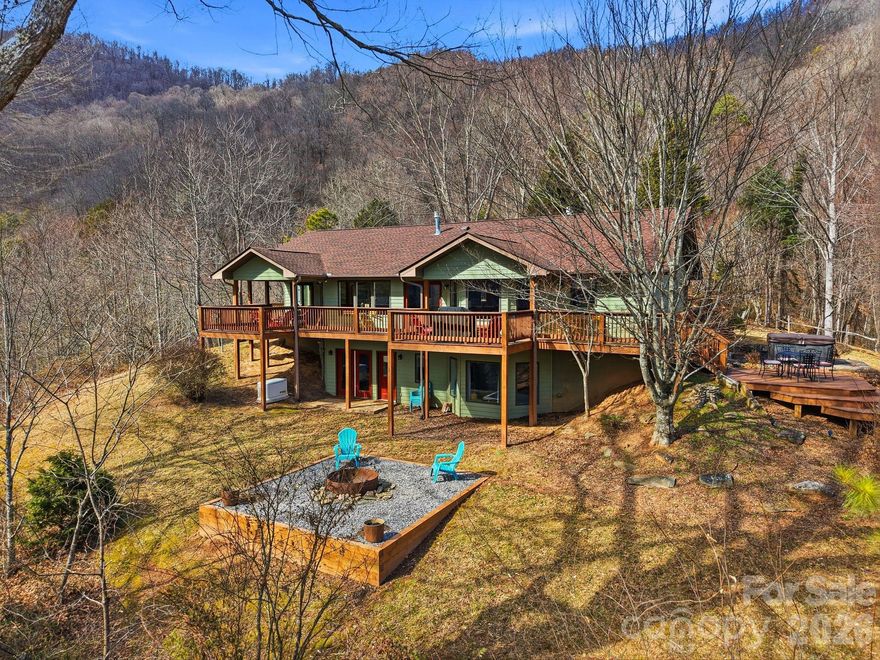 Escape to your own private mountain sanctuary, where peaceful seclusion and outdoor adventure exist in perfect balance. Sweeping views and inviting interiors set the stage for a remarkable retreat that pairs elevated comfort with the untamed beauty of the surrounding landscape. It’s perfectly suited for family gatherings, group retreats, or memorable getaways with friends.

Set on more than 90 pristine acres, this fully furnished, turnkey estate showcases panoramic mountain vistas and expansive living areas designed for both connection and quiet reflection. Dual kitchens on separate levels provide exceptional flexibility for entertaining, extended visits, or multi-generational living arrangements.

From the suite’s private entrance, step directly onto the deck and take in breathtaking mountain views—an idyllic setting for slow mornings with coffee or tranquil evenings at sunset. Enjoy uninterrupted access to nature while remaining wrapped in the comfort and charm of your mountain escape.

The lower level opens to a welcoming backyard that mirrors the spectacular views found above. Ideal for recreation or relaxation, this outdoor space invites everything from lively gatherings to peaceful moments of rest. A spacious fire pit, offers the perfect place to unwind beneath a canopy of stars while gazing out over the majestic mountain range.

After a day exploring your expansive acreage, retreat to the private sauna for a restorative escape. Just steps away, the hot tub awaits—an inviting place to soak in warm, bubbling waters as the cool mountain air and night sky surround you.

Thoughtfully cared for and previously operated as a successful vacation rental, the home blends comfort, versatility, and opportunity—whether you’re seeking a personal mountain sanctuary, an income-producing property, or a legacy estate to share for generations. A rare offering defined by privacy, acreage, and flexibility in an extraordinary setting.

Please do not enter or drive by without an appointment. Gated entrance.  The home technically has 4 bedrooms, but must be advertised as two bedroom due to septic permit.