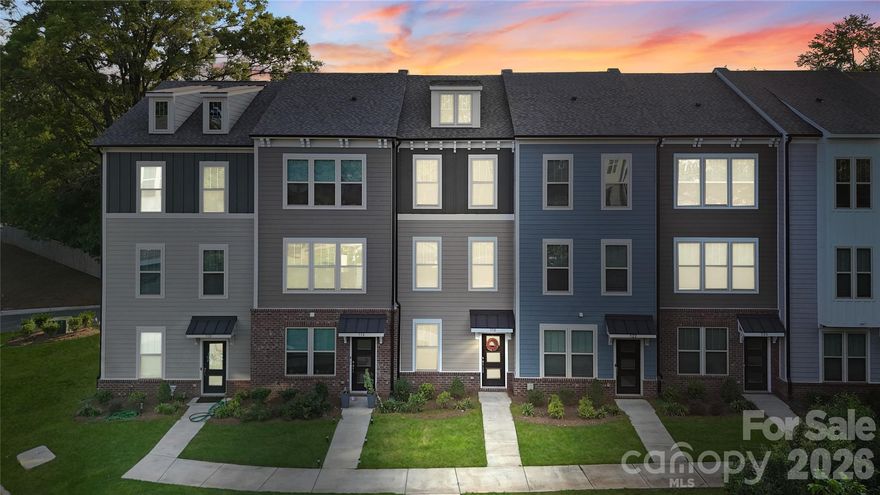 Stunning & Impeccably maintained three-level townhouse offering 2 bedrooms and 2.5 bathrooms. The open-concept main level features stylish vinyl plank flooring and numerous upgrades with custom designer touches throughout. The bright, airy living space flows seamlessly into the modern kitchen, complete with abundant cabinetry, custom tile backsplash, generous counter space, a center island with breakfast bar, and a dedicated pantry. The dramatic dining area showcases board-and-batten detailing, custom paint, and direct access to the balcony—perfect for entertaining. Upstairs, a split-bedroom layout provides dual primary suites, each with private ensuite baths for ultimate comfort and privacy. An attached garage adds convenience, while city views offer a touch of urban charm. This home beautifully blends comfort, style, and location—an exceptional place to call home.