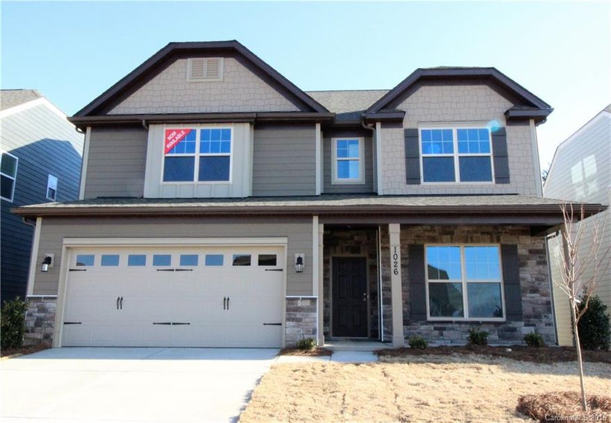 Wonderful floorplan with tons of space! Whirlpool tub, carriage style garage door, crown molding, iron rail and pickets and upgraded flooring throughout!  Premier kitchen boasts maple cabinets, granite countertops, hardware, tile backsplash, recessed lighting and stainless appliances! Come see and make this beautiful home yours today!