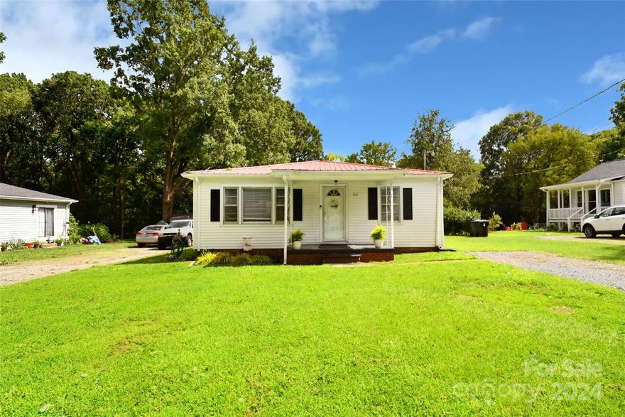 This cute-as-a-button ranch would be amazing for a first-time buyer or investor. In the desired 28027 zip code of Concord, this home sits on a wonderful, quiet street and has a private wooded lot. The sweet front porch opens to the ample sized living area and flows into the open dining space and to the large kitchen. The upgraded kitchen offers granite and stainless appliances and a coffee bar. The mudroom is awesome and connects to a huge laundry room with tons of storage space. There are two spacious bedrooms and an updated bath and this home truly lives large. Outside is a deck and a large outbuilding barn. Don't miss this home at this price!
