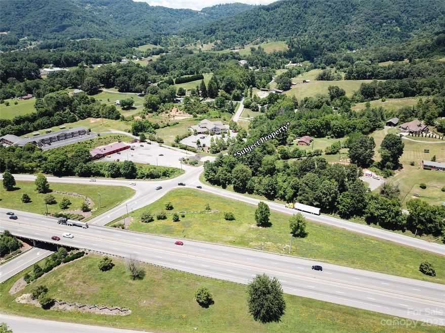 Fantastic opportunity immediately off of exit 31 on Interstate 40. Just under two and a half acres with high visibility road frontage on Buckeye Cove Road in Canton, NC. Land has access to water and sewer and has rolling terrain with very manageable topography. Ideal location for a residential builder/developer or a variety of commercial uses.  Only five minutes to downtown Canton and 20 minutes to downtown Asheville.  Unique opportunity to have access to water and sewer all while being open use.