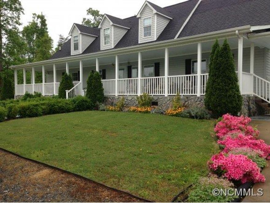 Privacy!! Home is positioned away from road w/ trees all around. Circular drive for easy access. Lg level front yard. Enjoy relaxing in Nature on HUGE 10x66 front porch. Nicely landscape yard. Home has lg open living room w/ gas log fireplace. Kitchen w/ many cabinets & eat in dinning rm. Split bedroom floor plan. Spacious master suite. 2 rms upstairs ideal for game/hobby/office/play rooms. Laundry rm w/ sink. In country yet just mins. from town