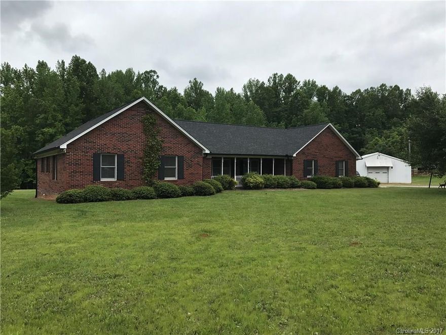 Well Maintained brick home on almost 5 acres.  Home has large eat in kitchen with breakfast bar, large laundry/mudroom, two car attached garage, covered patio off back and front of home.  Also features a oversized detached garage workshop area.  Very private setting.  Perfect area for horses or livestock.  A must see!