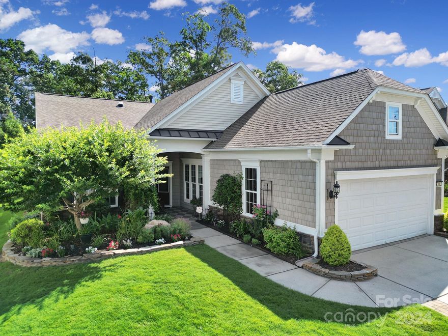 Prepare to be impressed by this beautiful Surrey Crest home w/ endless upgrades! This 2 bed/2 bath home has a lovely hideaway backyard made for outdoor living with views of the lake! You'll enjoy listening to the water flow in the fish pond while relaxing underneath the lighted pergola! Lovely manicured garden beds in the front & back w/ an irrigation system. Inside, the kitchen boasts upgraded SS appliances, upgraded soft-close cabinets, granite counters, & over/under cabinet lighting. Brazilian teak floors flow through the main living areas, w/ the comfort of carpet in the bedrooms. Entertain in the great room w/ a built-in TV cabinet & gas-log fireplace, or in the custom sunroom w/ sliding doors that lead out to the backyard! Primary suite has a tray ceiling & en-suite bathroom w/ a soaking tub, glass shower, upgraded dual-sink vanity, & a custom walk-in closet w/ cedar floors! Garage has epoxy floors & fixed stair attic access. Too many features to list- come see this home today!