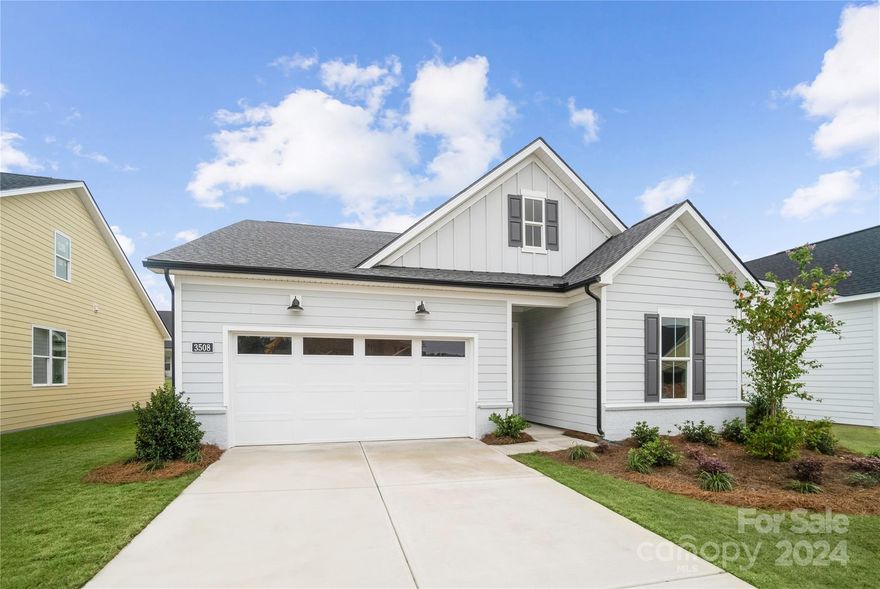 Brand new construction, is ready now with an outstanding price adjustment! This Mallard Elite plan is a joy to call home with 4 bedrooms and 3 bathrooms.. The foyer offers a lovely view of the elegantly appointed great room with a large rear covered patio, central to the well-designed kitchen complete with an airy casual dining area, large center island with breakfast bar, plenty of counter and cabinet space, and a sizable walk-in pantry. Enhancing the serene primary bedroom suite area walk-in closet and marvelous primary bath with a dual-sink vanity, a luxe shower with seat, linen storage, and a private water closet. Secondary bedrooms feature large closets and a shared hall bath. Additional highlights include a convenient everyday entry and a centrally located laundry. The Pines at Sugar Creek is Charlotte's newest 55+ Active Adult neighborhood near Ballantyne featuring 378 single family homes. Fabulous amenity center underway for 2026.