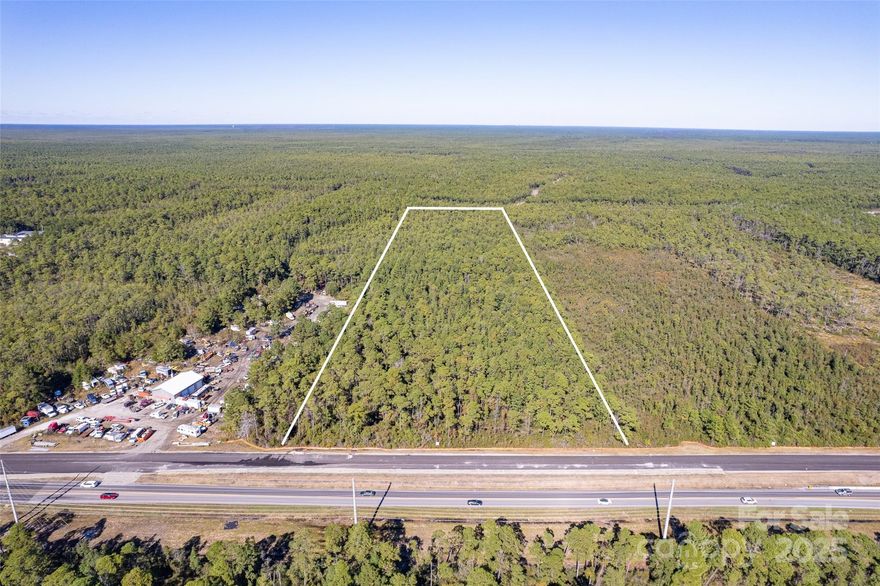 Large Price Reduction!  Prime commercial acreage at St. James/Southport for sale! This property is ideal for commercial development, located directly off of Highway 211 (Southport-Supply Rd) near the St. James Plantation entrance. Topography is level & wooded with over 430ft of road frontage & tons of road visibility/passerby traffic! Municipal water & sewer available. Property lies just outside of the city limits just minutes from Southport, St. James & Oak Island. Current road widening will be complete in 2027 resulting in 4-lane highway frontage & increased road visibility/traffic for this property. Do not miss this incredible opportunity! Contact Listing Agents for more information!