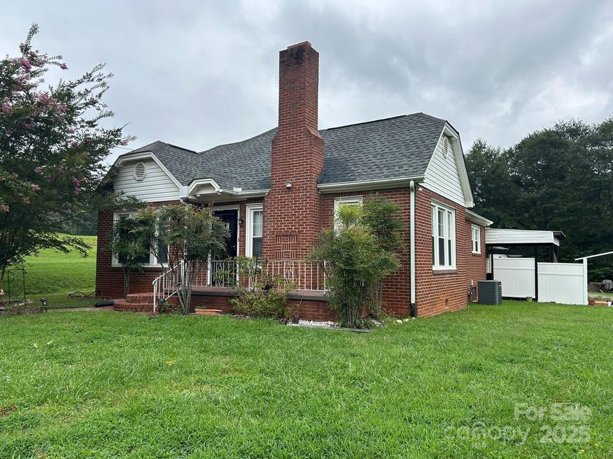 Attractive brick home w/detached 20'x24' garage & good size lot in convenient location! Home is move-in ready & waiting for its new owner. Features include nice hardwood floors throughout, large living room w/wood-burning fireplace & insert, arched doorway to dining room, bonus room w/separate entrance would make a great home office or can be used as a bedroom, remodeled bathroom w/walk-in shower, laundry in back addition (not heated, so not in total sq.ft.), partial basement great for storage, covered patio area, 18'x20' covered area great for entertaining or can be used as a carport, large usable side yard, and circular driveway. Home sits back off road and once new 221 extension is completed, traffic should greatly decrease, contact NCDOT for expansion maps. Call for more information/details.