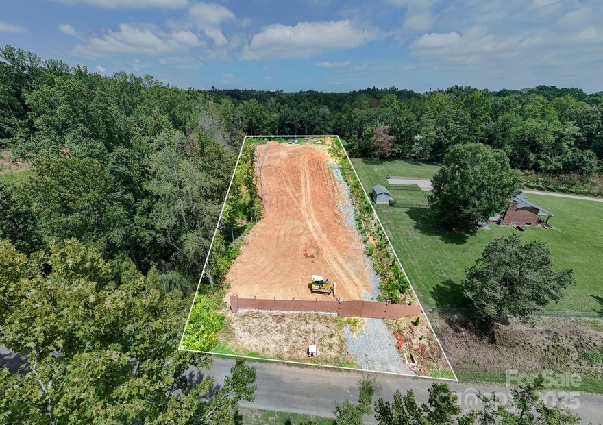 Unlock the potential of this prime residential lot tucked in an established Charlotte community with no HOA and tons of privacy. This property has already been freshly leveled and offers tree-lined views, a front gate entrance for added privacy, and a charming creek along the side—a rare find so close to the city.

Just minutes from Uptown, NoDa, and Plaza Midwood, the location delivers both convenience and opportunity. Whether you’re looking to build your dream home, invest in rental housing, or design a modern infill project, the property sets the stage for long-term value. With the potential to subdivide, it also appeals to developers seeking flexibility.

Utilities are available nearby to streamline the build process, and the lot’s established neighborhood setting ensures peace while still being close to shopping, dining, parks, and major highways.

Don’t miss this versatile property that blends natural beauty with city access. Bring your vision to 3132 Beaman Avenue today!