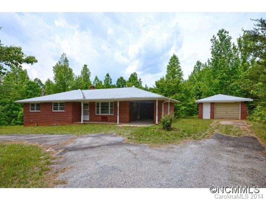 Brick home situated on 3 acres w/mature trees. Covered front porch,spacious LR w/wood floor and large windows. Eat in kitchen w/door to private backyard and 2nd door w/convenient access to the attached carport. 3 bedrooms, all w/wood floors and full bath w/tiled tub/shower. Basement w/full bath and spacious unf. area w/windows and outdoor access, great for storage/workshop. Separate 1-car garage and convenient circular driveway. USDA financing.