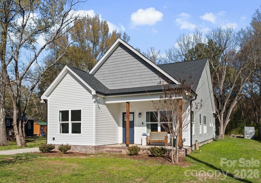 Step into this 2023 built Craftsman-style home, offering 3 bedrooms and 2 baths, perfectly situated on a private 0.39-acre lot. A welcoming rocking-chair front porch sets the tone for relaxed living. Inside, you’ll find an abundance of natural light and an open-concept layout featuring a spacious great room, and a dedicated dining area. The classic kitchen is thoughtfully designed for both everyday living and entertaining. The primary suite provides a peaceful retreat, complete with a walk-in closet and a well-appointed bath featuring dual vanities. Two additional bedrooms and a stylish full hall bath offer comfort and quality finishes throughout. Additional highlights include a convenient laundry area and storage room just off the kitchen. Step outside to a covered back porch overlooking a private, wooded backyard—perfect for quiet mornings or evening gatherings.