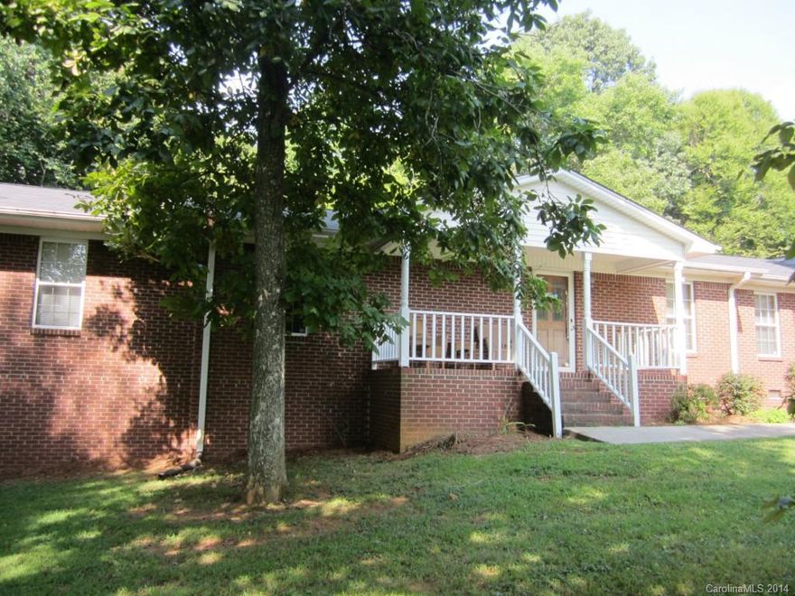 Brick rancher with rocking chair front porch and back deck for cookouts. Fire pit in back yard for cool evenings. Kitchen with snack bar open to den with fireplace and access to back deck. Recent interior painting and carpet. Roof 2012. Nice workshop/storage room in garage. Partial basement with garage door and exterior door and potential for future expansion. Situated on a partially wooded lot with beautiful landscaping.  Hardwood flooring in foyer, living & dining.