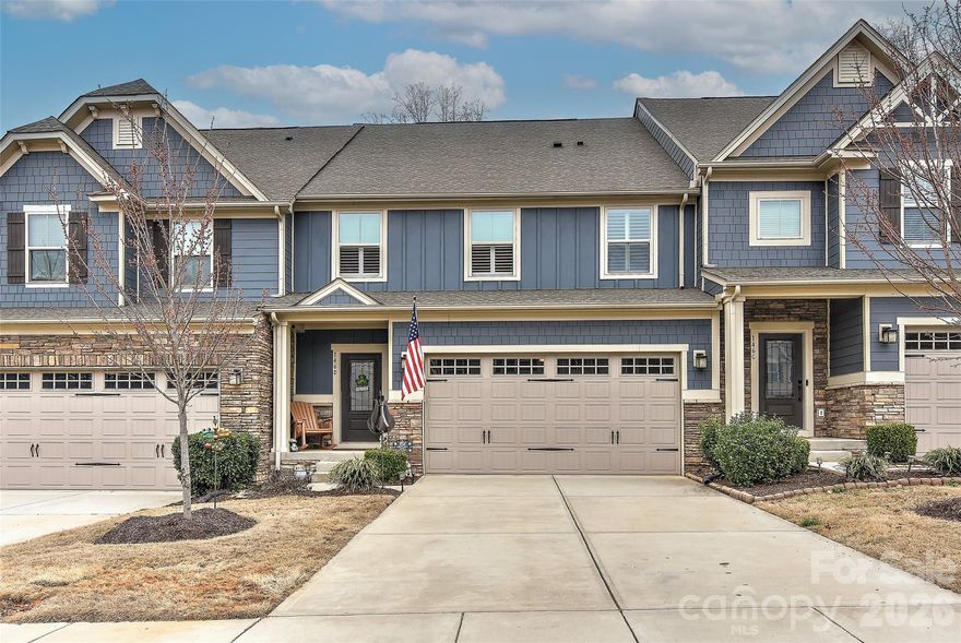 Waterfront community minutes to Langtree shopping, dining and I-77 access! This 3 level townhome offers the flexibility you've been searching for! A vaulted 2-story living room with decorative fireplace is open to the dining area and kitchen. The chef's kitchen boasts ample cabinet & counterspace, tile backsplash, pantry and bar seating. Stainless steel appliances include double wall ovens, dishwasher, microwave and gas cooktop. Just off the kitchen is the spacious laundry room with overhead cabinets & dropzone, powder room and garage access. The main level bedroom boasts a trey ceiling with ceiling fan and tiled bath with double vanity, tiled shower & walk-in closet. Upstairs you'll find an inviting loft overlooking the living room, two guest bedrooms, full tiled bath and walk-in storage. The finished lower level features a huge bonus/game room, bedroom full tiled bath and walk-in storage. Outdoor living area includes a relaxing deck and lower patio with fenced yard overlooking wooded natural areas. Upgrades include plantation shutters, easy care luxury vinyl flooring and finished garage with epoxy flooring. Gated waterfront amenities feature a picnic pavilion with grilling area, firepit with seating picnic tables overlooking the water and a kayak/paddleboard launch.