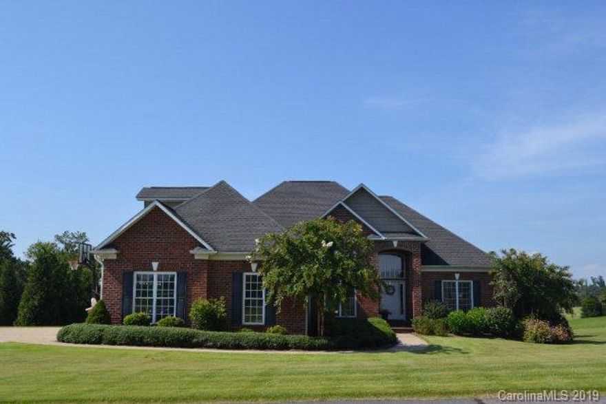 This custom brick home was built in 2006 and is centered in the gated prestigious Silver Creek Plantation community. Beautiful curb appeal with manicured landscaping. This home has plenty of living area with 4 bedrooms and 3 1/2 baths. The open living area leads to a sunroom that has a wall of windows overlooking hole #2 on the Silver Creek golf course. There are two side decks off the sunroom with Trex decking that are perfect for grilling out. The master bedroom and bath are on the first floor with two additional bedrooms and full bath. The kitchen has custom cabinetry and tons of countertop space, perfect for the in home chef! Basement area is set up perfectly as an in-law suite and additional entertainment area. It has a kitchenette, office, full bath with jacuzzi tub, workout/rec area, an additional room and multiple storage areas.