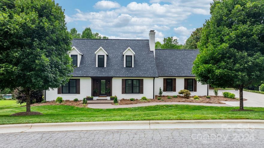 Radiates with love and warmth the moment you arrive. Elegant wood framed door creates a stunning first impression. Enter and be greeted by a spacious foyer, exquisite hardwood flooring and crown molding that extends throughout the main and an impressive staircase. Living room with fireplace perfect for gathering with family. Painted kitchen cabinets, large island, granite countertops, stone backsplash. Primary suite located on main level offers a luxurious bathroom and frameless shower. Upstairs find two bedrooms, full bath, and bonus room Lower level designed for entertaining with wet bar with granite countertop, stone fireplace, full bath, bedroom, and bonus room. Inground pool perfect for hosting family/friends. Backyard is enclosed with black aluminum fence. 2023/2024 upgrades include exterior stain/paint, architectural roof, oversized gutters, new windows, insulated garage doors/motors, new refrigerator/microwave, Located in Woodridge Estates this home offers elegance and comfort.