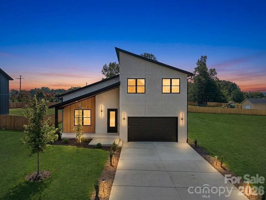 A rare opportunity to secure Luxury living at an exceptional price. New Construction Luxury Modern home showcasing elevated design, exceptional craftsmanship, and everyday functionality. Thoughtfully designed for both comfort and style, this new construction features 3 spacious bedrooms plus a bonus room, including a main-level primary suite and a secondary upstairs suite ideal for guests or extended living.

The light-filled open-concept layout is enhanced with soaring ceilings and a striking fireplace, creating a warm yet sophisticated focal point flowing effortlessly into the chef's kitchen featuring ceiling-height custom cabinetry, quartz countertops, stainless steel appliances, and a generous walk-in pantry.
Spa-inspired bathrooms offer sleek glass-enclosed showers, while custom walk-in closets with built-ins provide both luxury and functionality. 

Step outside to the covered back deck, perfect for entertaining, grilling, or relaxing in a peaceful setting.
Additional highlights include high-end LVP flooring, soundproofed walls, custom cabinetry throughout, a large walk-in attic for additional storage, and a spacious two-car garage.

Enjoy the freedom of no HOA fees- while having easy access to dinning, shopping, and everyday convenience. Short-term rentals, including Airbnb, are allowed- offering a strong investment opportunity and potential for future income.