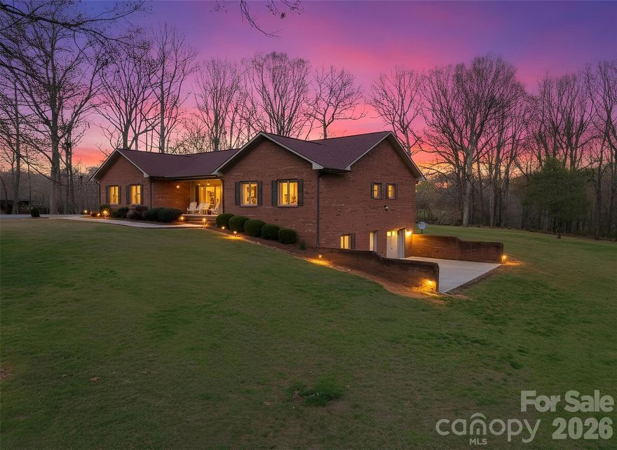 24 ACRES~ Brick Ranch~Full Basement~CREEK~ FENCED PATURES~ONE OWNER HOME! This property offers a RARE combination of open pasture, a scenic creek, and endless potential for farming, recreation, or a private retreat. This 3 bedroom, 2 bath home features approximately 2,055 heated square feet plus a full unfinished basement (Over 2000 additional Sq Ft unfinished), providing ample space to expand or customize. Inside, you’ll find hardwood and tile flooring, spacious bedrooms, and a light-filled living room with a large picture window and stone gas log fireplace. The kitchen offers custom oak cabinetry, updated stainless steel appliances, an island, and a window overlooking the backyard, with a formal dining area that captures peaceful views of the back pasture. The full basement includes over 2,000 additional square feet, is plumbed for a bathroom, and features a garage area and access from both inside and outside, while the main-level garage easily accommodates two vehicles. Outside, the property shines with approximately 20+ acres of fenced pasture, a beautiful creek(great for animals), and a covered tractor/implement storage, making it ideal for horses, cattle, or a mini farm. Enjoy quiet mornings from the covered front porch or take in sunrise views from the back porch overlooking the land. The back 22 acres is curently on land use taxes and a new buyer an look into staying on land use by contacting the Alex. Co. Tax office.  Bring your animals and your vision—this property offers the space and flexibility to make it your own. **Showings by appointment only please. Currently no propane hooked to gas logs. TWO tax pins & two deeds make up the approximately 24 acres~~NO recent survey buyer to do a survey if they choose to verify acreage. ASK agent for additional information available on MLS attachments. A few outside pics are twilight enhanced. ~~ Please call Alex. Co. Tax for Land Use Tax details. Call Zoning for details on the R2R zoning. ADDRESS: 328 Davidson Ct. Taylorsville, NC 28681.