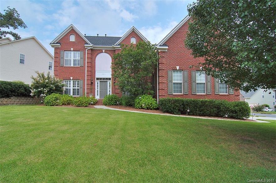 Beautiful executive home on corner lot in Sutton Place. 5 bedrooms/3 full baths with formals & elegant dual staircase. Hardwoods & carpeted floors throughout living areas. Chef's kitchen features center work island and plenty of cabinets w large breakfast room.  2 story great room w gas log fireplace. Guest suite w walk in shower on main. Oversized master on upper level features tiled shower/whirlpool tub. Spacious secondary bedrooms. Landscaped water feature in back yard. Fort Mill schools.
