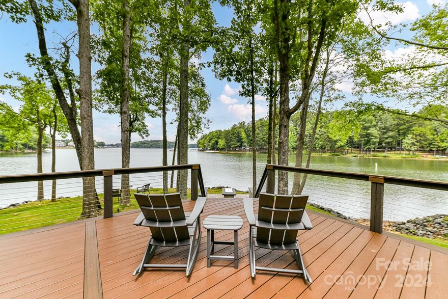 Rare Find & Lake Davidson's Premiere, Waterfront Lot with 184' of shoreline! Beautiful, Remodeled, 4 Bedroom, 2.5 Bath Home located in one of the most desirable, sought after neighborhoods in Davidson. Spectacular Water Views from private Deck & most Rooms! Quartz counters, high end appliances in Kitchen & plenty of modern cabinetry for plenty of storage space! Vaulted Great Room with huge windows for stunning Water Views! Custom, high end lighting throughout! Spinnaker Cove has it all! 37 homes are surrounded by Lake Davidson and have tennis, lake, salt water pool, gathering areas and docks. Walking distance into historic Davidson for restaurants, shops, live music, farmer's market & more! Spinnaker Cove features Lake Davidson access and community boat slips, This quiet, splendid section of the lake provides for great "quiet-water" kayaking, canoeing, and paddleboarding. Waterfront trail adjacent to Spinnaker Cove neighborhood.