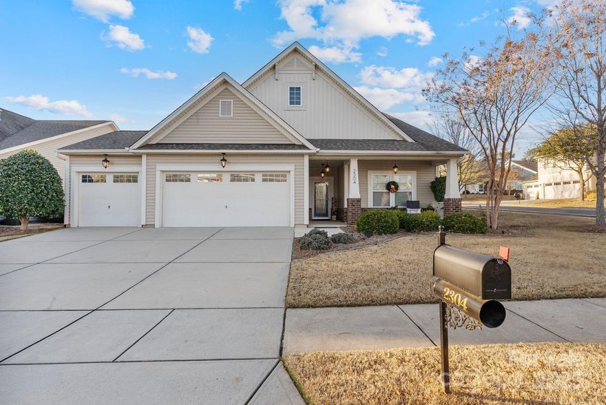 Welcome to 2304 Celandine Way in sought-after Tega Cay—where the location truly is amazing and the lifestyle feels like a daily getaway. Set on a bright corner lot, this home delivers an open, light-filled layout that immediately feels expansive, warm, and easy to live in. Natural light pours through the main level, highlighting the generous room sizes and the way each space flows effortlessly into the next. The primary suite on the main floor is a standout retreat, featuring its own sitting area that’s perfect for reading, relaxing, or even a quiet work-from-home nook, plus a large walk-in closet and a luxurious spa-style standing shower that makes everyday routines feel elevated. The kitchen is both beautiful and highly functional, with crisp white cabinetry, sleek countertops, a double-oven setup for serious cooking or entertaining, and a comfortable sit-in dining area that invites casual breakfasts and weeknight dinners, while a separate full dining room gives you a more formal space for hosting holidays or gatherings. Anchoring the heart of the home, the living room offers a cozy fireplace and plenty of space for oversized furniture, movie nights, or game-day crowds without ever feeling tight. You’ll also appreciate the flexibility of having a second bedroom on the main level—ideal for guests, a nursery, or a private office—adding to the home’s smart, versatile design. Upstairs opens into a large second living room that can become whatever you need most: a media lounge, playroom, teen hangout, or extended entertaining area, along with an additional spacious bedroom that keeps everyone comfortably spread out. The screened-in back porch and open front porch extend your living space outdoors, giving you multiple places to enjoy Carolina evenings, morning coffee, or weekend downtime. With the HOA covering lawn care, your time stays yours—so you can fully enjoy the community’s pool, clubhouse, tennis and basketball courts, walking trails, and more, and take advantage of everything that makes Tega Cay so loved, from its lake-town charm to its proximity to Fort Mill, Rock Hill, and Charlotte. Overall, this home offers the rare combination of bright openness, truly spacious rooms, and a layout that adapts beautifully to real life—whether you’re hosting big, spreading out, or simply soaking up how good it feels to live here.