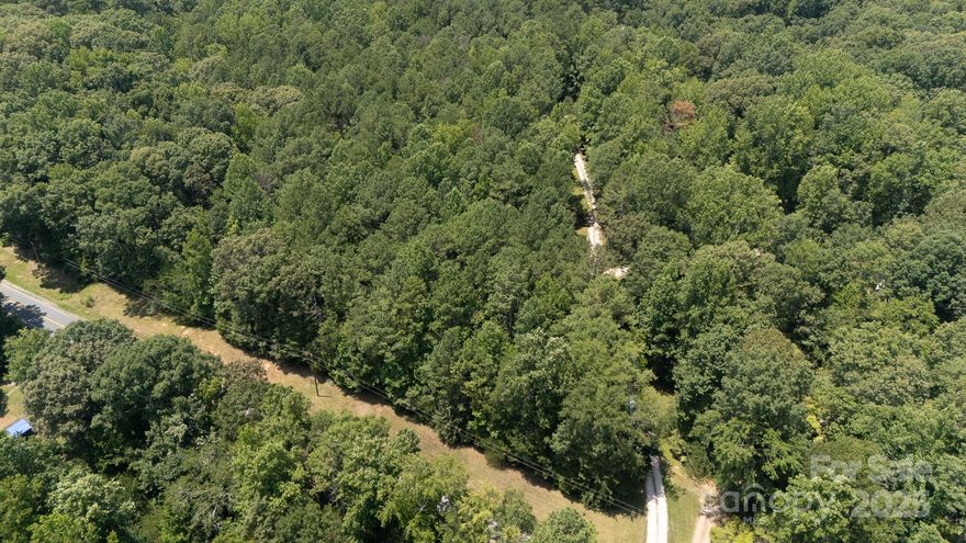 Land, Land, Land!   Build your dream home on this tract of 5 beautiful acres zoned AGC.  This parcel is part of 435-00-00-011 and the 5 acres is being surveyed off.  This tract is very private and has a bevy of hardwood trees and pines.  A deeded road easement runs on the right side of the road-frontage tract.  Location is private and is conveniently located near Chester, York and McConnells with a straight path to I-77, Exit 82 in Rock Hill for Charlotte commuters