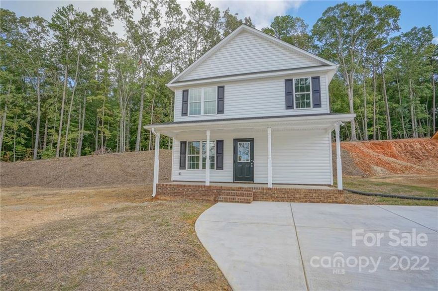 Wonderful light-filled new construction with NO HOA abnd almost 1/2 acre! This address qualifies for 100% USDA financing. Conveniently located, this three bedroom two-story home is just waiting for your personal touches. With an open feel, the kitchen and dining room create separation between rooms while still keeping an open feel on the main level of this home. The spacious kitchen features granite counters and stainless appliances and, did we mention, lots of natural light. The main level also has laundry space and a half bath. The upstairs boasts three nice sized carpeted bedrooms. The two upstairs bathrooms feature granite counters and vinyl plank flooring. Schedule a showing today to check out this great new construction without the worry of an added HOA fee.