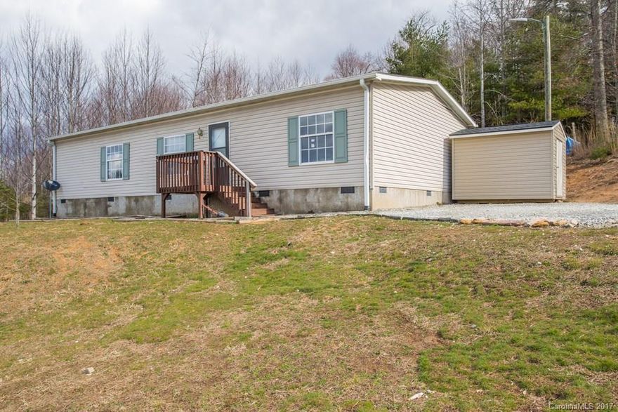 What a great home with many recent updates. Last year the house was freshly painted fully inside, new laminate floors, new hardware, heat pump serviced, new storage building and so much more. This home is priced to sell quickly so don't wait long. Excellent location and at a cool elevation, gentle land with lots of rear and side yard privacy. Located at the county line so convenient to Brevard and Hendersonville. Split bedroom, large rooms and ready for you to move in.