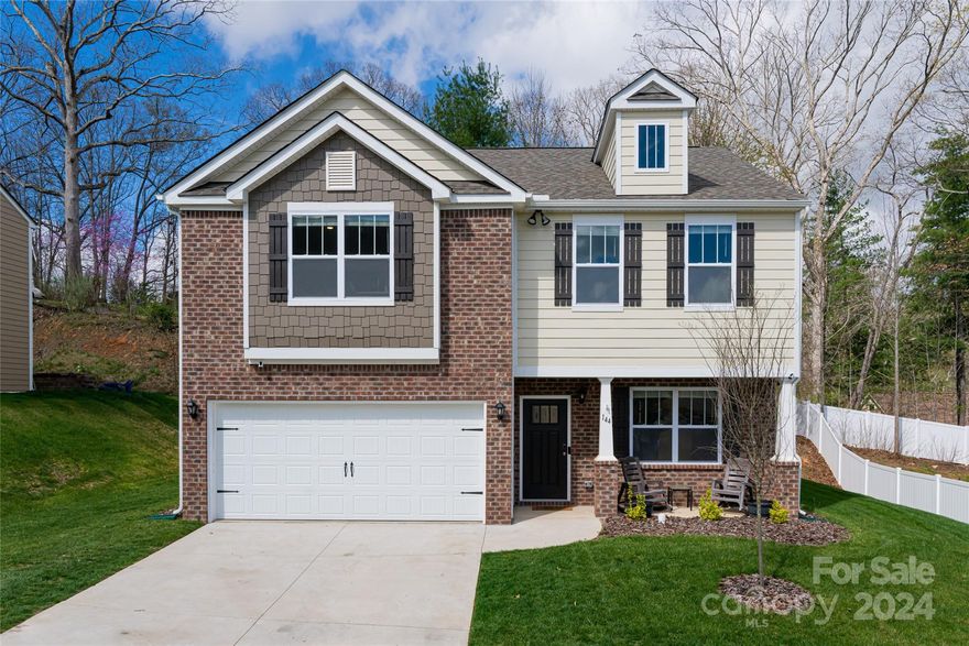 Discover serenity and sophistication in this contemporary 3-bedroom, 2-bathroom stunner by DR Horton, located in Holbrook Village within the popular Candler community and only 7 miles to downtown Asheville. Embrace the seamless fusion of elegance and functionality in this "nearly new" residence, boasting over 2,000 square feet of bright and airy living space, with impeccable finishes and abundant storage.  Savor tranquil mornings on the sun-kissed private backyard patio, while enjoying the mountain view.  You'll love the convenience of being just minutes to all Asheville has to offer. Closer to home, gather at the community pool, perfect for enjoying warm Summer days with friends and neighbors. And the best part: skip the wait for new construction as this meticulously maintained home is move-in ready, saving you time and added expense.  Experience modern living – schedule your private tour today and call Holbrook Village your new home!