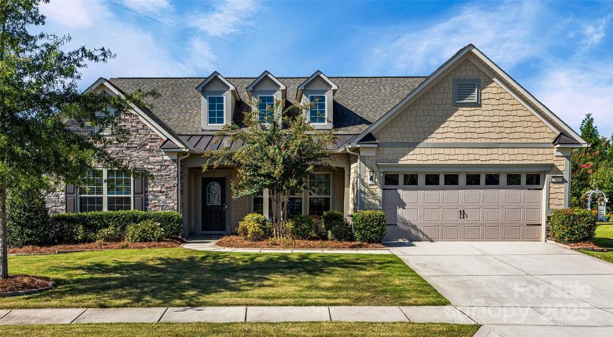 Absolutely STUNNING Tangerly Oak plan in Carolina Orchards! You will fall in love with this meticulously maintained one-owner home with one of the most sought after floorplans in the community. The main floor features an office with French doors; a gourmet kitchen with a large center island, a gas cooktop, double wall ovens, a large pantry and tons of cabinet and counterspace; a primary suite with a tray ceiling and an oversized zero entry spa shower; a second primary bedroom with a private bath and a walk-in closet; a formal dining room; a large living room with a beautiful stone fireplace; a laundry room with cabinets and a deep sink; and a drop zone off the garage entry. Large windows provide tons of natural light throughout the home, and the open floorplan is perfect for entertaining. The oversized bonus room upstairs is the perfect additional space for a craft room or play room. Outside, you will love relaxing on the three-season sun room with retractable windows and the expanded patio overlooking the spacious yard with mature landscaping. The oversized garage features a tandem parking space that's perfect for a workshop or golf cart. The community offers endless entertainment with resort-style amenities including an indoor pool, outdoor pool, clubhouse, fitness center, dog park, walking trails, tennis courts, pickle ball courts, fire pit, meeting rooms, and an activities director. Lawn maintenance is included with HOA dues.