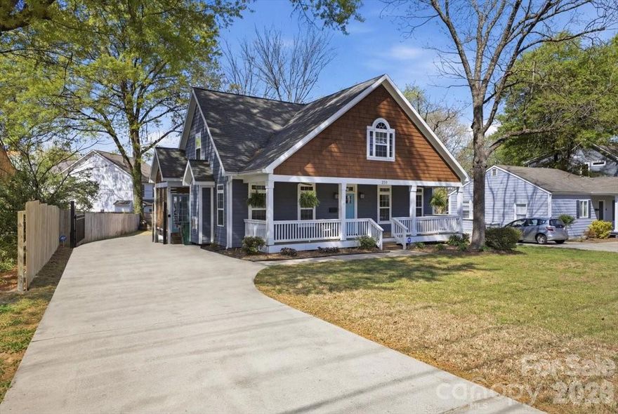 Fantastic custom craftsman home with 4 bedrooms and 2.5 baths.  Perfectly located in the heart of Villa Heights, walkable to NODA, Plaza Midwood and close to the light rail.  The refinished hardwood floors throughout the main floor will lead you to a beautiful kitchen, with plenty of storage and side entry mudroom.  Primary on the main floor with soaking tub, walk-in closet, double sink vanity and tile shower.  The second level loft is perfect for movie nights, playroom or game space.  The large covered front porch and expansive back deck make this home an entertaining dream.  New two car detached garage built 2024, fenced back-yard and electric gate.  Garage pre-wired for electric car charger. New downstairs HVAC (2025).