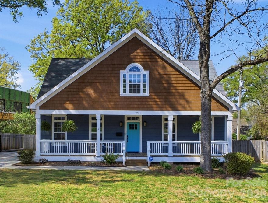 Fantastic custom craftsman home with 4 bedrooms and 2.5 baths.  Perfectly located in the heart of Villa Heights, walkable to NODA, Plaza Midwood and close to the light rail.  The refinished hardwood floors throughout the main floor will lead you to a beautiful kitchen, with plenty of storage and side entry mudroom.  Primary on the main floor with soaking tub, walk-in closet, double sink vanity and tile shower.  The second level loft is perfect for movie nights, playroom or game space.  The large covered front porch and expansive back deck make this home an entertaining dream.  New two car detached garage built 2024, fenced back-yard and electric gate.  Garage pre-wired for electric car charger. New downstairs HVAC (2025).