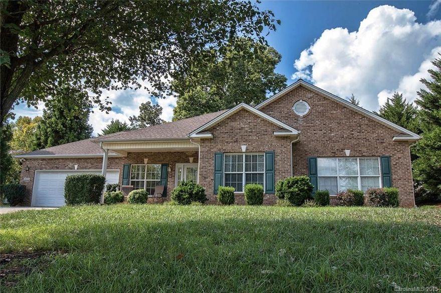 Lovely BRICK RANCH in great location in NE Hickory. Ready to move in & enjoy! Enjoy the pleasant neighborhood from the covered front porch.  Hardwoods, fresh, neutral colors, easy floor plan. Spacious living room w/custom fireplace.  Open, light and airy huge eat-in kitchen w/ample counter space, custom tile floor, bar area and skylight.  Master w/large bathroom, double vanities & generous walk-in closet.  2 add'l bedrooms tastefully done in neutrals & large laundry & 2nd full bath.  Big garage.