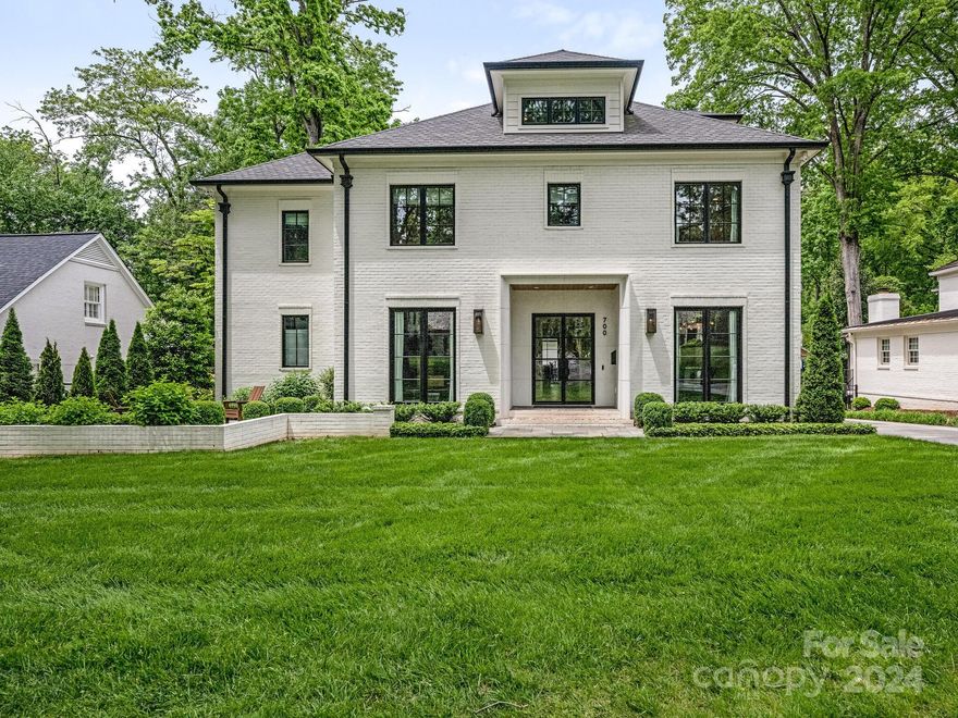 Unique combination of elegant design and function! Steel and glass entrance welcomes you to generous foyer, flanked by formal dining room and library. Impressive details and designer selections throughout--- wide plank white oak flooring, high ceilings, handsome millwork and windows in all the appropriate locations highlight the floorplan. The culinary kitchen features top line appliances, large island, site built cabinetry, walk in storage and butler's pantry. Main level owner's suite with floor to ceiling windows, opulent bath with heated floors and striking closet with dedicated washer/dryer. 
Upstairs, you will find 4 spacious bedrooms each with walk in closets, private home theatre, huge bonus/playroom and an awesome laundry room.

The covered terrace features blue stone flooring, vaulted panelled ceiling, dedicated heaters and fireplace.  Detached garage is upfitted with electric charging station and large partially finished area above