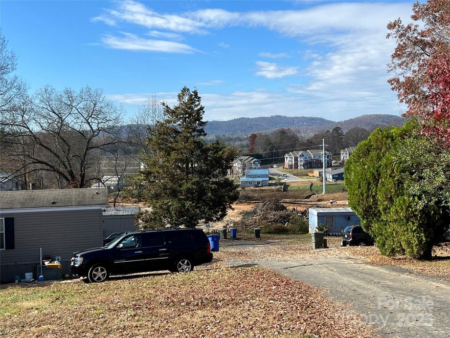 Sunset Heights Mobile Home Park, long established mobile home park inside Hendersonville city limits. Almost 3 acres zone C-3 (Commercial). As a current mobile home park with 12 original lot spaces, now only 9 lot space occupied and rented, with a very large 2 story house that is also currently rented. Long term tenants at below current market rate rents. Call for rent rolls and expenses. 
Highest and best use probably as vacant land for future commercial development. City water and sewer tap in place and connected to the large house only. The mobile home lots have city water but not city sewer, as they are on septics.
Priced to sell at $700,000, current tax Assessed Value is $1,101,600. Adjoins Park Ford dealership at the top of Duncan Hill Rd. 
Please do not drive through or contact tenants.