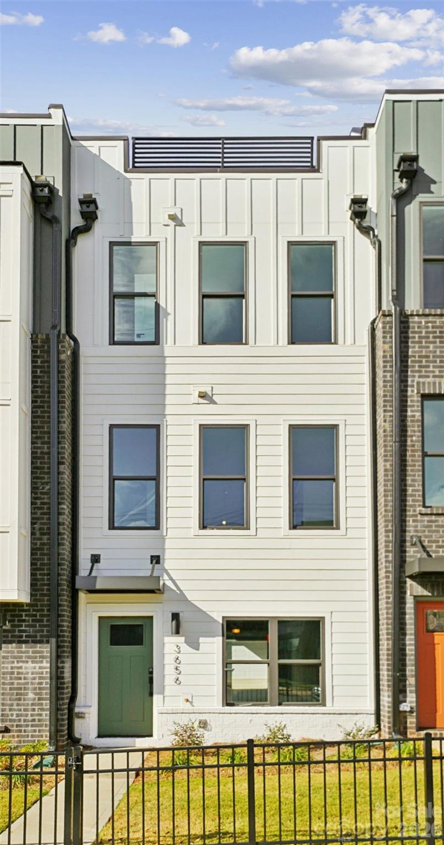 Experience modern luxury in the heart of LoSo, one of Charlotte’s fastest-growing areas. This brand-new, move-in ready Dunbrook floorplan townhome, offers 3 bedrooms, 3.5 baths, and a 2-car garage—with a private en-suite bath in every bedroom, ideal for roommates or guests.
Designed for seamless indoor-outdoor living, the open-concept main level extends from the Great Room to a outdoor living area, while the rooftop terrace provides an elevated space for entertaining or unwinding. The designer kitchen features quartz countertops, soft-close cabinetry, and a spacious island, complemented by hardwood stairs and luxury vinyl plank flooring throughout the main living areas and fourth-floor bedroom.
Additional highlights include durable Hardie Plank siding, crown molding, zoned thermostats for enhanced comfort, and abundant natural light throughout.
Located just two blocks from the LYNX Blue Line at Scaleybark Station, with quick access to South End’s dining, breweries, and Uptown.
Limited-time financing incentives available—contact agent for details.