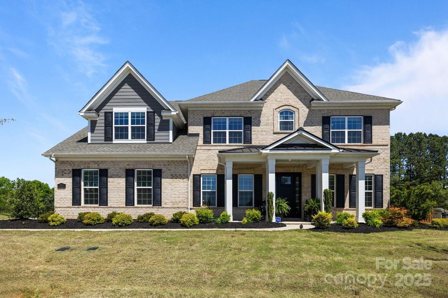 This must-see Weddington estate offers the pinnacle of modern luxury and serene living with lush, wooded backyard views, and an oversized 3-car side-load garage. Welcoming you is an oversized porch, a grand entrance with 10’ ceilings, exquisite millwork and a spa like atmosphere.  Gorgeous hardwoods guide you through the library and formal dining. Gourmet kitchen with a huge island and pro grade SS appliances, farmhouse sink with reverse osmosis, private office nook, and spa-like primary suite with private balcony. All bedrooms have en-suite baths. Huge bonus room with designer shiplap and surround sound-perfect for media, recreation, or retreat.  The show stopping sunroom with EZ-breeze windows provides effortless entertaining and retreat. Minutes from Waverly, Rea Farms, and Blakeney. Award winning Weddington School District.