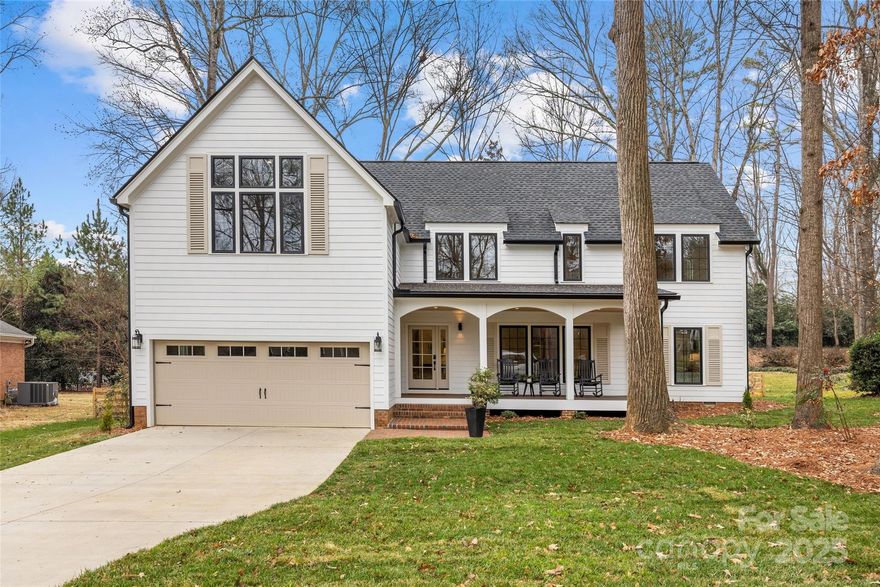 Fully reimagined 1973 ranch with brand-new second story completed December 2025—a rare blend of established Woodbridge charm and modern luxury on a private, wooded 0.38-acre lot.

The main level offers easy one-floor living with a spacious primary suite, updated kitchen with oversized island, and a light-filled dining room with dry bar that works beautifully as a home office or morning room. Step through French doors to the screened porch—your true second living room for much of the year—overlooking the serene, fenced backyard.

Upstairs is where this home sets itself apart: a vaulted-ceiling rec room perfect for media or studio space, two additional bedrooms, a dedicated office, and a built-in sauna. This is not filler square footage—it's a fully realized second floor designed for how you actually live.

Exterior details deliver timeless curb appeal: crisp fiber cement siding, black-framed windows, classic columns, and a welcoming front porch. Two-car garage with interior access. All systems and finishes are new or updated.
Woodbridge address. Move-in ready. Nothing to do but settle in.