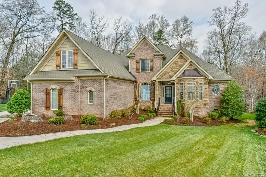SPECTACULAR Brick & Stone Custom Home with Fabulous Outdoor Living Space with PRIVATE Wooded View! Covered Deck, Patio, Firepit, Private Master Suite Deck. Stunning Great Room w/stone fireplace open to GOURMET Kitchen w/Bfast Area & Bar. SS commercial appl., gas cooktop, convection double oven, granite, tile backsplash. Luxurious Master Suite w/elegant Bath. Top notch electronic system including-The Nest. Must See this nestled on a quiet cul-de-sac in amenity rich nghbrhd close to Charlotte!