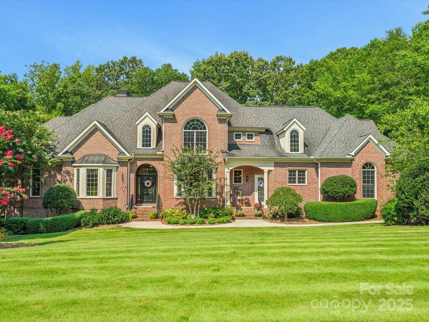 Discover a one-of-a-kind custom-built, full brick home w/unparalleled finishes & exceptional features! Main level boasts high ceilings, extensive moldings, 8-foot doors & gleaming hardwood floors. Formal LR & DR adorned w/ bay windows. Stunning 2 story great room, w/built-in cabinets, gas logs & tons of natural light. The oversized kitchen offers warm cabinetry, an island, double oven, wet bar & built-in desk area.  Main level primary BR features a tray ceiling & a spa like bath w/separate vanities, jetted tub & large shower. Upstairs, find 3 generous ensuite bedrooms, each w/a walk-in closet, plus a large bonus room & a versatile flex space perfect for media room, gym, or office. Outside, enjoy the screened porch, covered porch & fenced acre yard w/a heated saltwater pool. The pool house, ideal as a secondary living quarters, includes a kitchen, BR / LR area, full bath & laundry room. Addt'l  features include large workshop, central vac, air filtration system, surround sound & more!