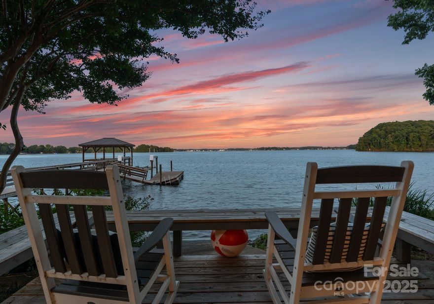 Crown Jewel Of Lake Norman! BREATHTAKING  VIEWS FOR THREE MILES!  Exceptional opportunity The most sought after address on Lake Norman. Nestled on a private cul-de-sac.. Create your own signature lakeside estate with stunning year round deep water . Almost an acre lot and 200 feet of pristine shoreline.  Expansive waterfront from both the front and back of the house.The potential for this property are boundless!
Bring your own builder and architect AND MAKE IT YOUR OWN! Live in the boat house for a while and make changes gradually. The possibilities are infinite. Or see demo quote attached in MLS and build an exquisite Waterfront estate