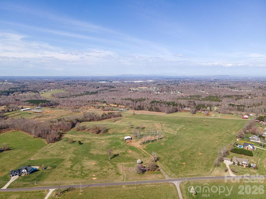 Over 21 Acres located east of town in a great location. Beautiful rolling terrain - mostly open - several proposed homesites. So many possibilities. Maybe you want to have a few horses. Maybe you are thinking of a family compound. Or are you a builder that would like to build a few homes? There's something for everybody. And if this isn't enough land, we have over 20 acres next door. Or maybe you're looking for something smaller. We could sell you a 10 1/2acre tract. We have something for everyone. And did I mention it's in the North Lincoln school district? Not far from Denver and nearby restaurants. Or jump on highway 16 and you will have a fast commute to Charlotte and Hickory.