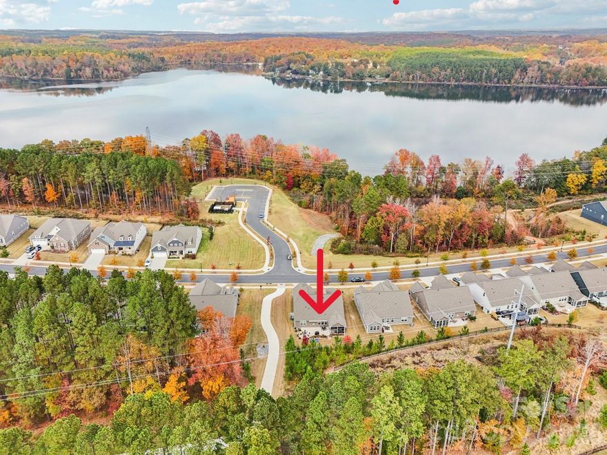 PLANED WATERFRONT AMENITY UNDERWAY!  INITIAL PHASE TO PROVIDE 42 BOAT SLIPS, 10 PERSONAL WATERCRAFT SLIPS AND KAYAK LAUNCH! 

This beautifully updated 3BR, 2.5-bath home in vibrant “Imagery on Mt Island Lake” has seasonal water views from the rocking chair front porch and just steps away from the future marina!
This one level Elmont mode on a corner lot will truly become your forever home.

Thoughtful upgrades create a turnkey living experience. The entire house features upgraded luxury vinyl plank flooring providing a cohesive, low-maintenance foundation throughout. Designer window treatments adorn every room, and remote shades add convenience and privacy in the guest room and dining area.

The heart of the home shows exceptional attention to storage and style: a custom kitchen storage system and designer lighting in both the kitchen and dining area make daily living and entertaining effortless. Features include upgraded double wall ovens and a sizeable, pristine quartz countertop.  The primary ensuite includes a custom closet organizer with built-in drawers to keep belongings neat and accessible.  Two additional spaces can flex as guest rooms or serve as an office. The spacious laundry room features a utility sink. Instant hot water at every sink!

The screened-in porch includes a ceiling fan plus privacy sunshades for relaxing outdoors while taking in the beautifully landscaped yard - an entertainer’s dream with a large paver patio, built-in planters, and a sitting wall surrounded by thoughtful landscaping that enhances privacy.  The remote-controlled awning stretches out over the patio for ease and comfort.

Imagery residents enjoy front and back lawn maintenance and the use of outstanding amenities cabins featuring a well-appointed library, textile/art studio, pottery studio and dog park. Care to be a little more active? Take a dip in the heated resort style pool open from May through October! Try your hand at pickle-ball/tennis on lighted courts! The fitness center offers free weights, exercise equipment and a separate studio for yoga, Pilates and even Zumba! Walk the wooded trails to enjoy nature lake-side! There are also  interesover 50 interest clubs in this vibrant community!