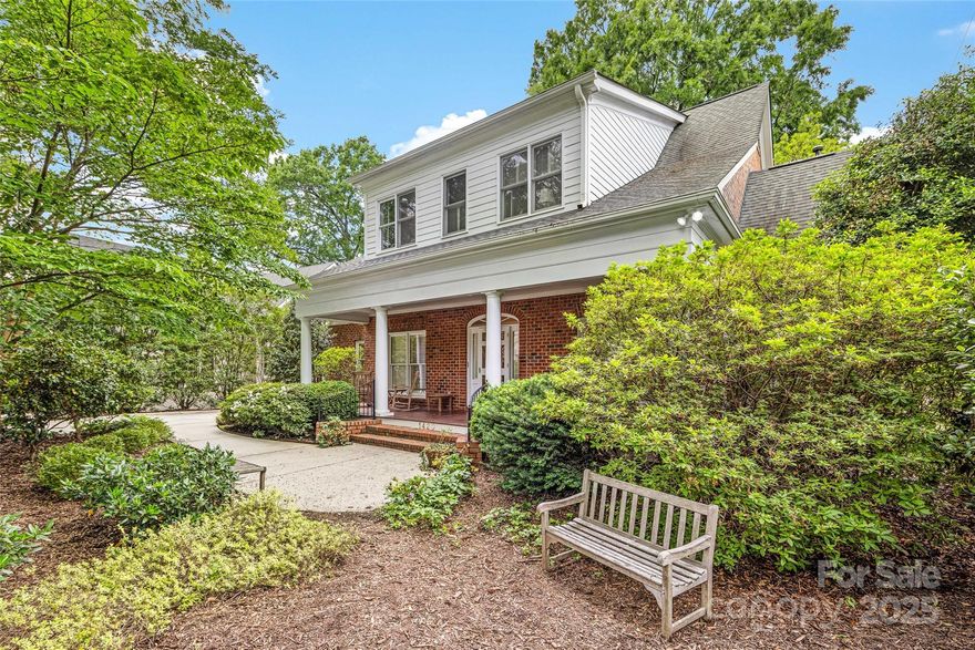 Charming home with rocking chair Front Porch on coveted street in Myers Park.  Simonini built with 9 ft ceilings, hardwoods down, plantation shutters and extensive built ins. Kitchen with Keeping Room opens to Family Room.  Primary Suite on main with large Primary Bath and walk in closet …. Ready for buyers finishing touches! Huge secondary Bedrooms upstairs with large walk in closets.  Bonus Room has built ins and extra walk in attic storage. Home has been freshly painted and new carpet upstairs. Tremendous outdoor living space…. Over 500 sq. ft. screened porch spans the back of the house. This is a gorgeous, private flat lot that backs up to Freedom Park. Beautiful landscaping with slate patio, stone accent walls and fountain with waterfall feature. Brick two car detached Garage has second Bonus Room upstairs perfect for Home Office, Library or Exercise room. 

Lovely low country charm in prime location with top notch school district !